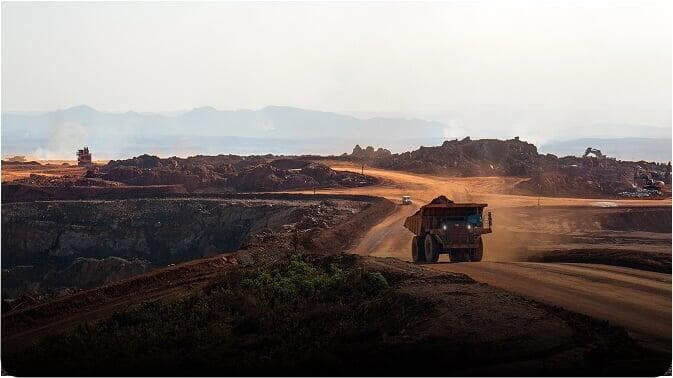 Aerial view of an open-pit mine with haul truck — drone mining survey